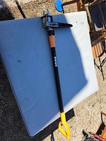 Full view of Fiskars stand-up weed puller on table