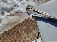 Cutting head with lopper and curved saw blade