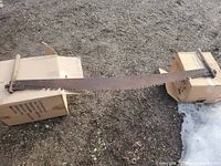 Full view of 64-inch crosscut saw resting on boxes