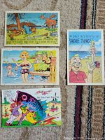Fronts of four illustrated comic postcards