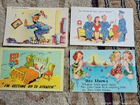 Fronts of the four illustrated postcards