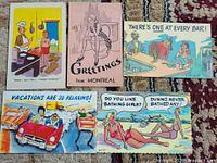 Fronts of all five postcards laid out on rug