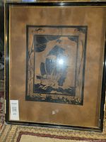 Full view of framed block print under glass