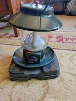 Lantern on base showing overall structure and colour