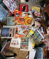 Overall view showing approximately 18 LP record jackets spread on floor
