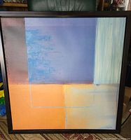 Front view of framed abstract canvas print showing colors, composition and signature