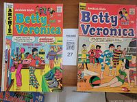 Both comic books laid side by side showing full front covers