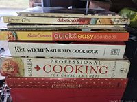 Stack of cookbooks showing spines
