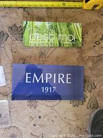 C’est Moi Bamboo sign and Empire 1917 sign