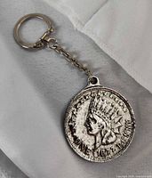 Full view of coin keychain front side with 1877 Indian Head penny design
