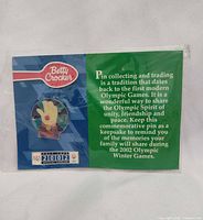 Front view of sealed pin on backing card