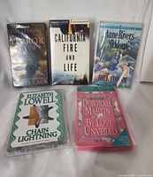 Group shot of all five sealed audiobook cassettes