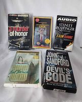 Group of five sealed audiobook cassette sets front view