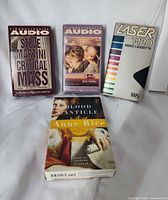 Four sealed media items laid out