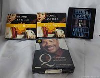 Group shot of all four sealed audiobook CD sets