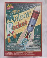 Front of Meteor Rocket kit box showing branding, age 9+, 17 inch rocket, 100 ft flight claim