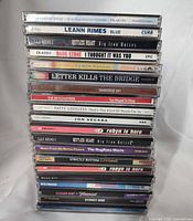 Stack of 20 CD spines showing artist and title information