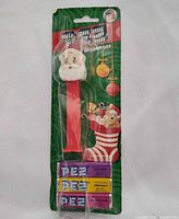 Front view sealed Santa PEZ dispenser with candy packs