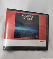 Front of case with title, author and 6-disc note