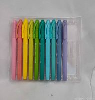 Front view of ten pens arranged in clear tray