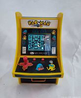 Front view showing screen, controls, branding