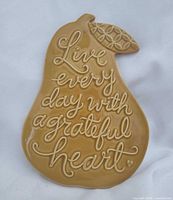 Front view showing inscription and pear shape