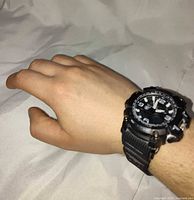 Watch worn on wrist showing overall size and face