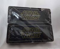 Front view of two shrink-wrapped Star Wars The Force Awakens card decks