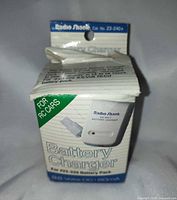 Front view of boxed Radio Shack battery charger