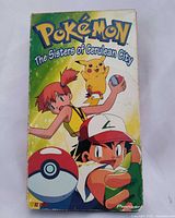 Front of VHS sleeve with title and characters