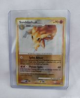 Front of Sandslash Lv.37 card inside sleeve