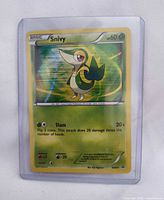 Front of Snivy card showing artwork, stats, holographic finish