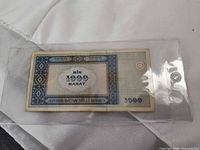 Reverse of Azerbaijan 1000 manat note in sleeve