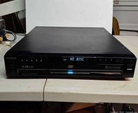 Front view of Sony DVP-NC665P showing display and disc tray