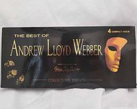 Front of slipcase showing title, mask graphic and 4 compact discs note