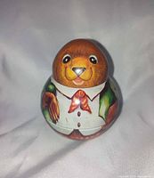 Front view of Shackman roly-poly bear showing facial detail and attire