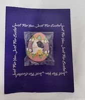 Front view of sealed Easter egg pin on display card