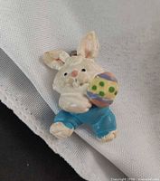 Front view of bunny brooch showing painted details