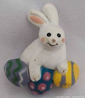 front view of rabbit brooch on eggs