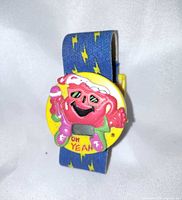 Front view showing Kool-Aid Man case and digital display