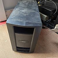 Front view of Bose PS28 III powered subwoofer showing enclosure and grille