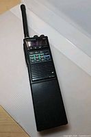 Full view of Kenwood TH-215A transceiver with antenna attached
