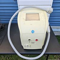 Front view showing touchscreen, logo, key switch and emergency stop