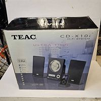 Front of Teac CD-X10i retail box showing product image and branding