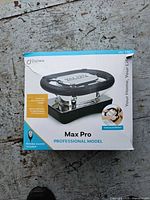 Front of retail box showing Daiwa Max Pro professional model massager
