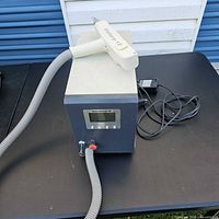 Full view of Victory 12 laser machine, wand and power adapter