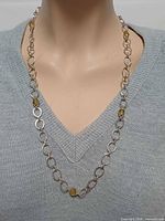 Necklace on mannequin, full view of links and bead stations