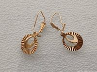 Earrings front view on fabric background