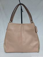 Front view of beige leather Coach Phoebe handbag