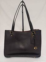 Front view of Coach Tyler Carryall handbag